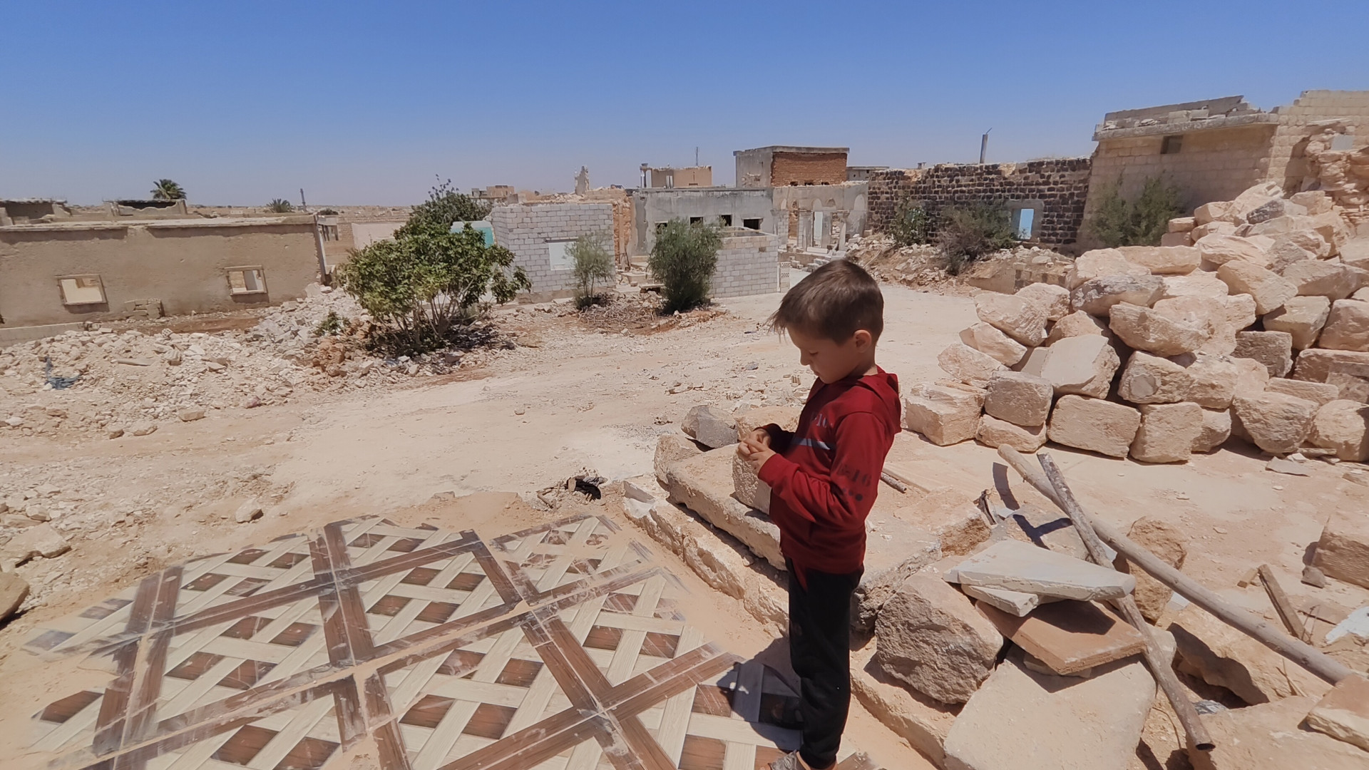 A ruined house and a burdened heart