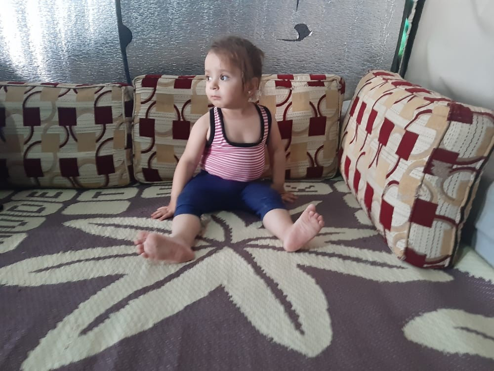 She is two years old, in need of medical shoes