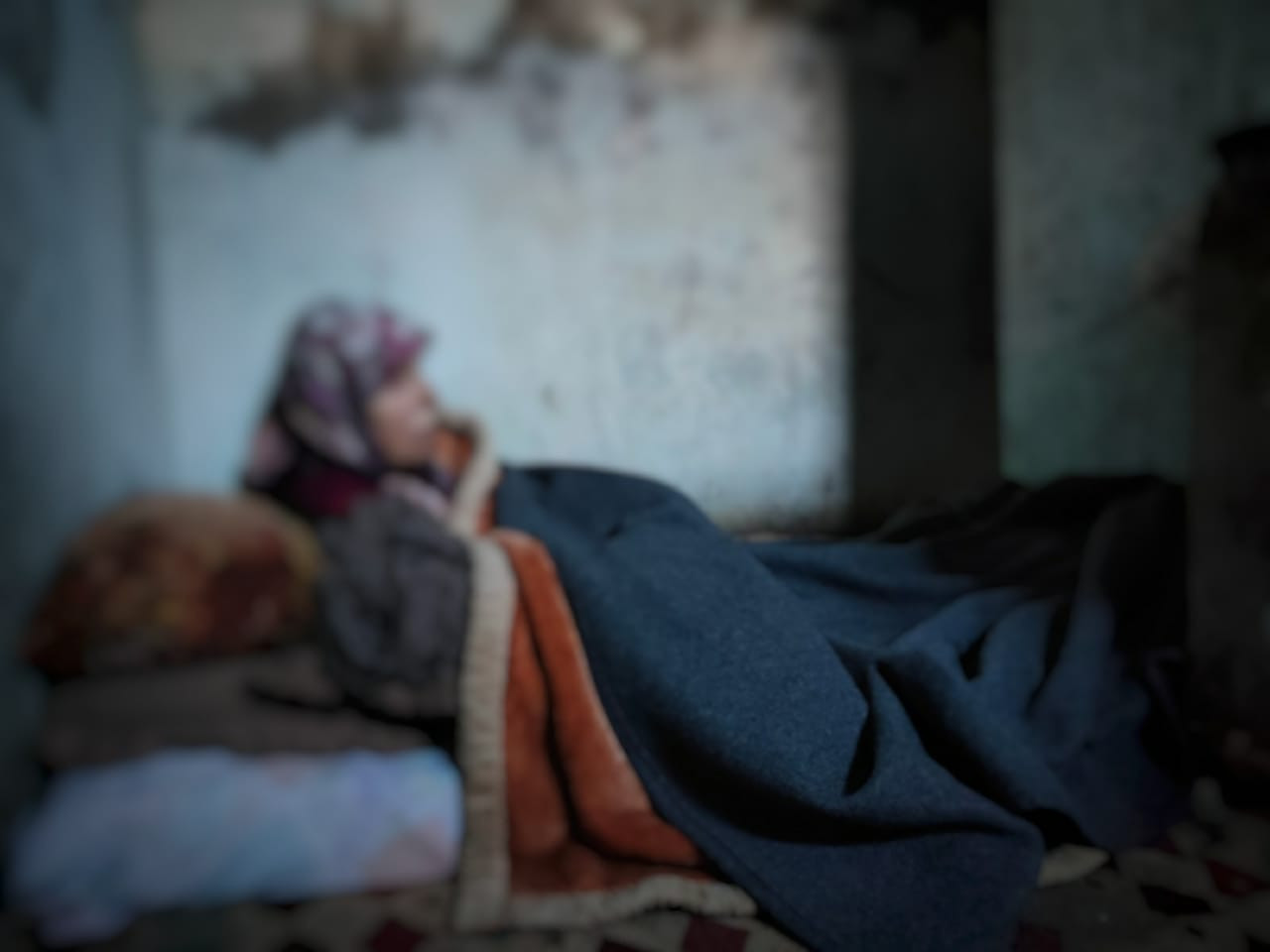 A woman endures miserable conditions