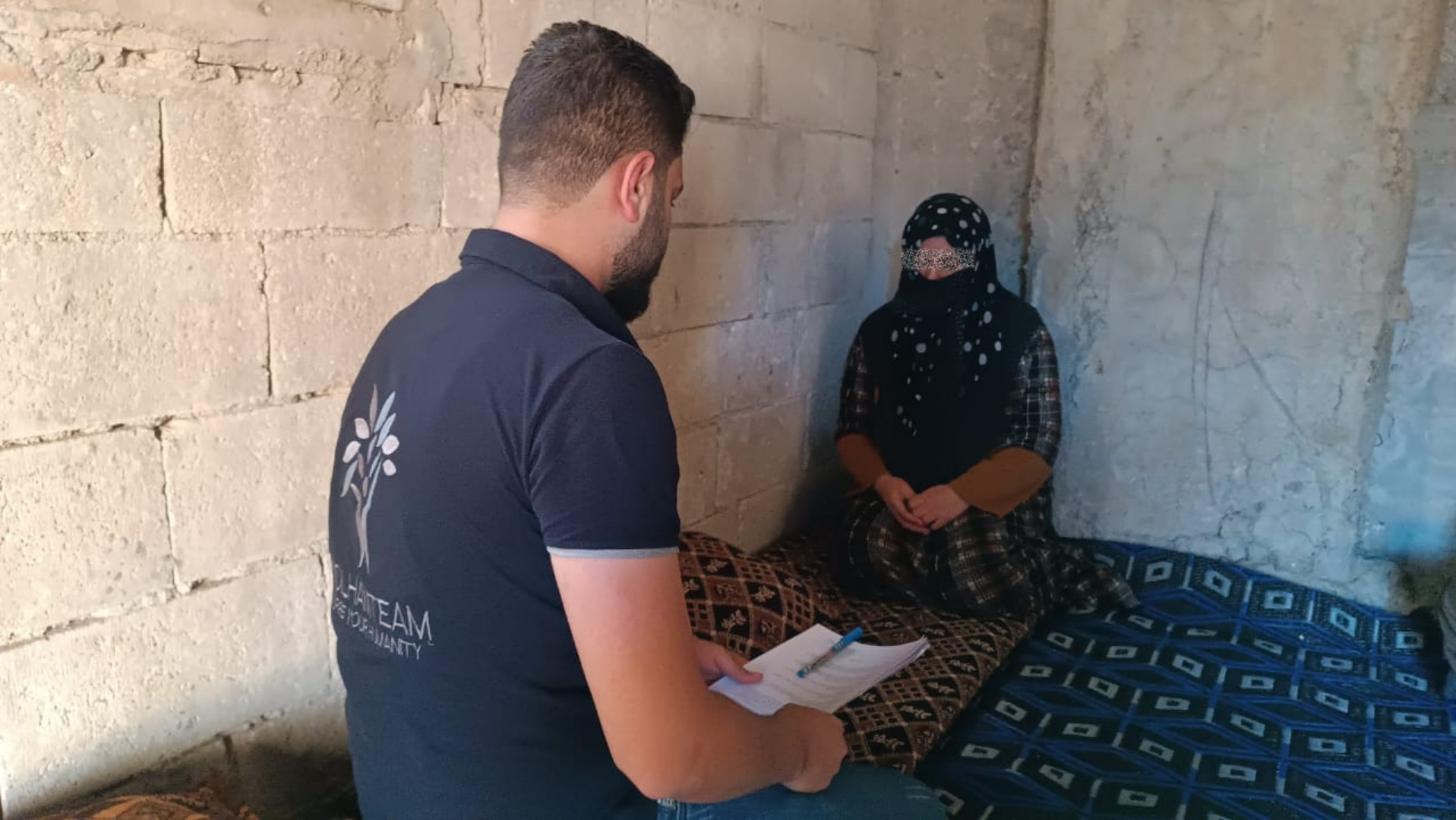 In a home without windows or doors, Rehab lives with her children.