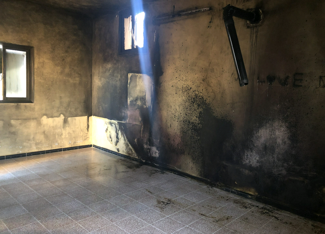 A family whose house was burned
