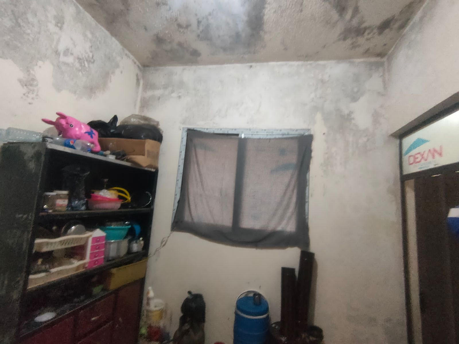 A family lives in a dark small room