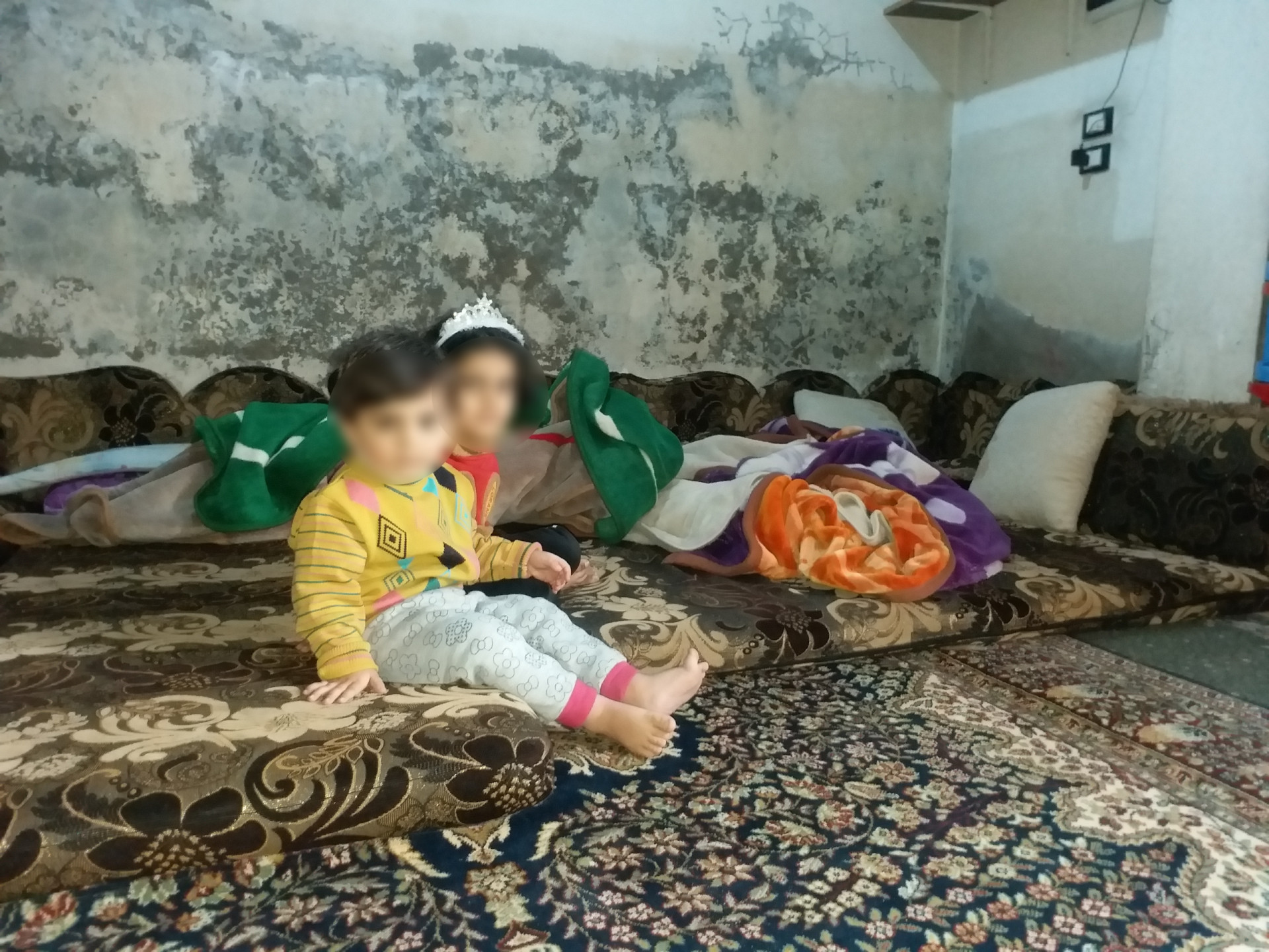 A family living in a rented store, suffering from the cold winter