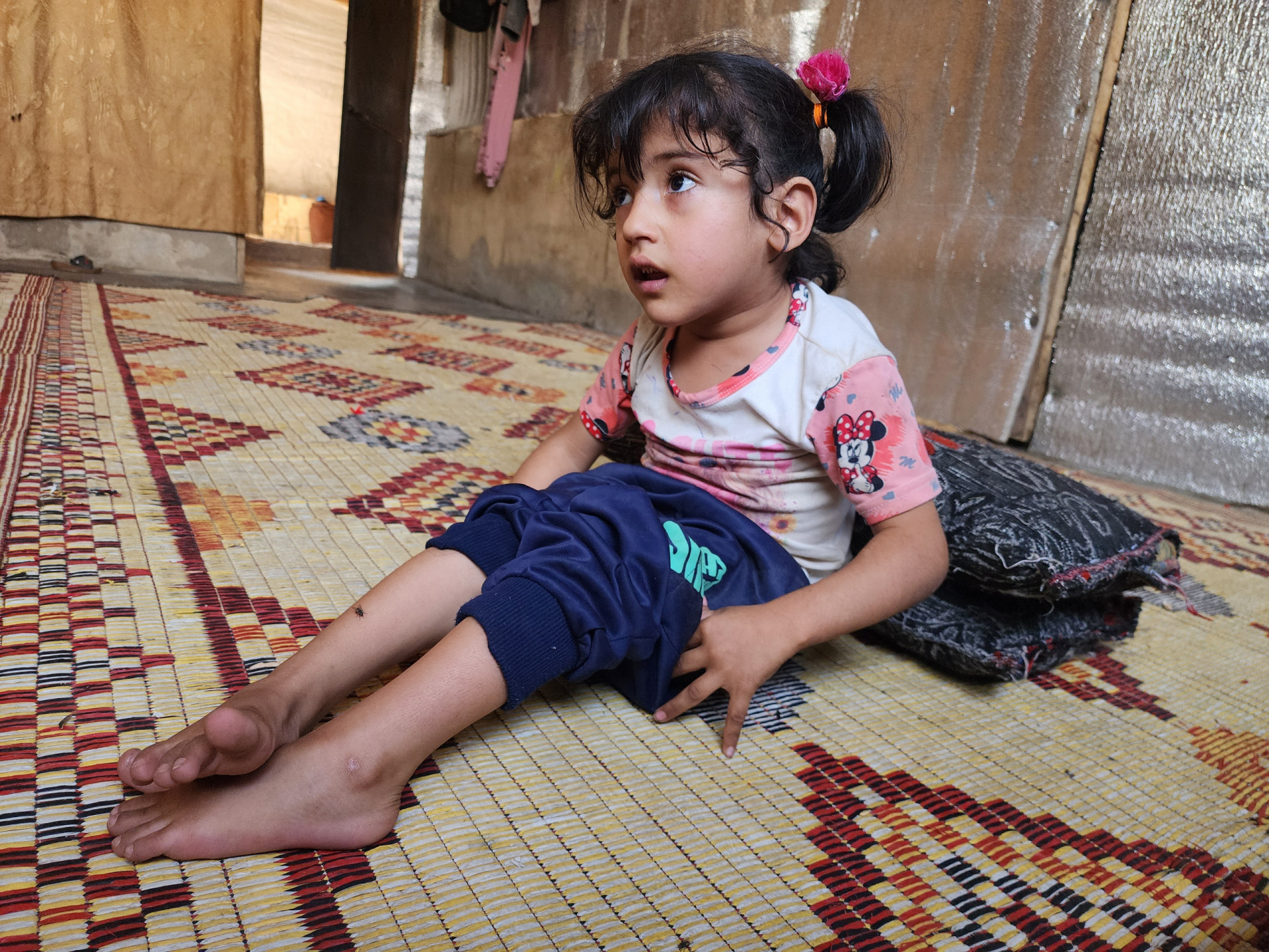 Inside a tent, two families share the pain of life