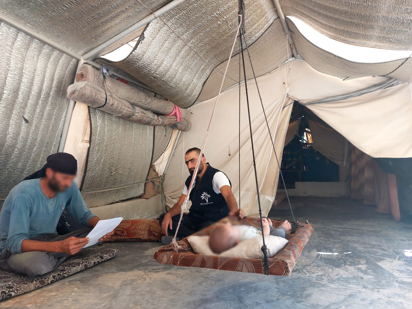 A family lives in a poor tarp tent!