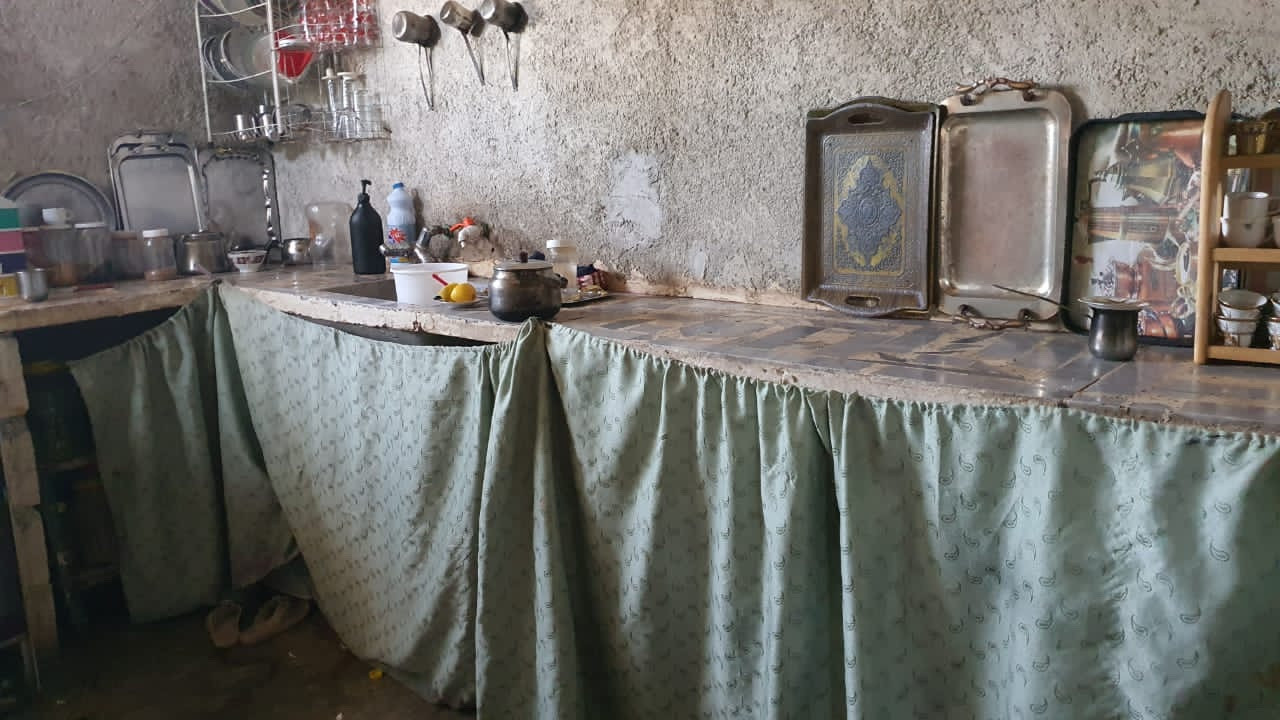 Three families share a small house and a little income