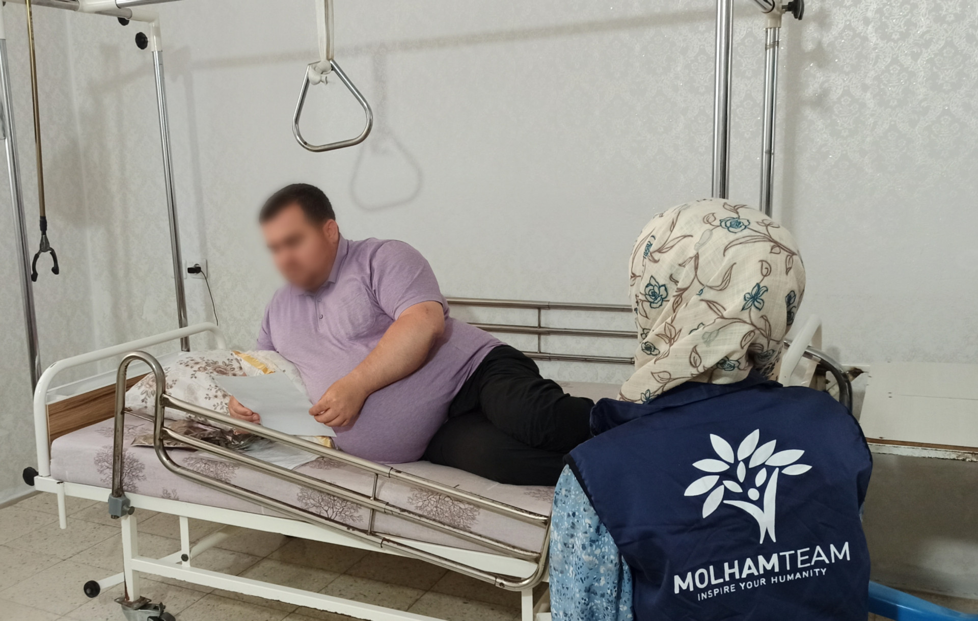 Nidal has been suffering paralysis for six years, and his wife became the breadwinner of the family