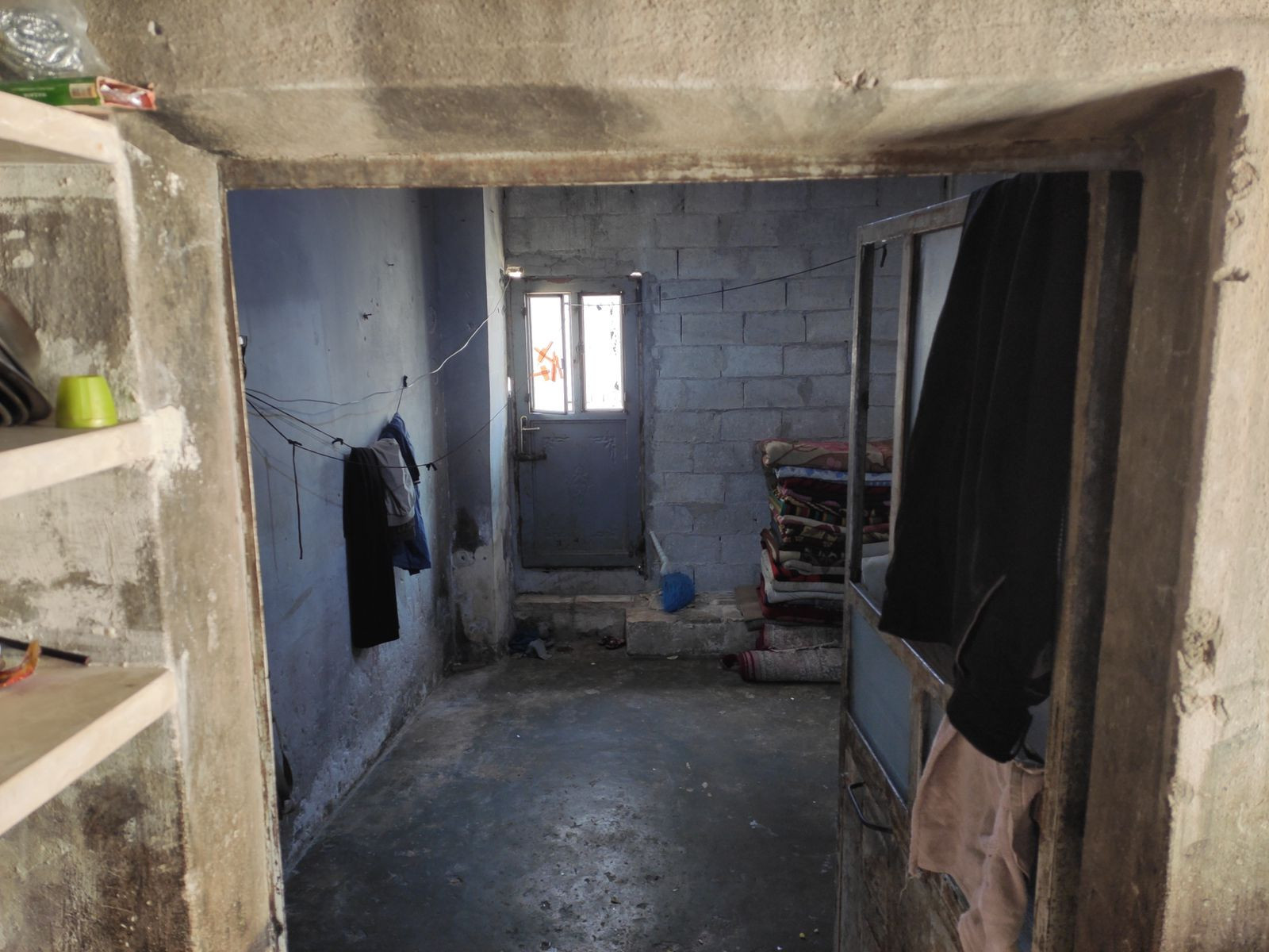 Iman and her five children live in a small shop without a provider