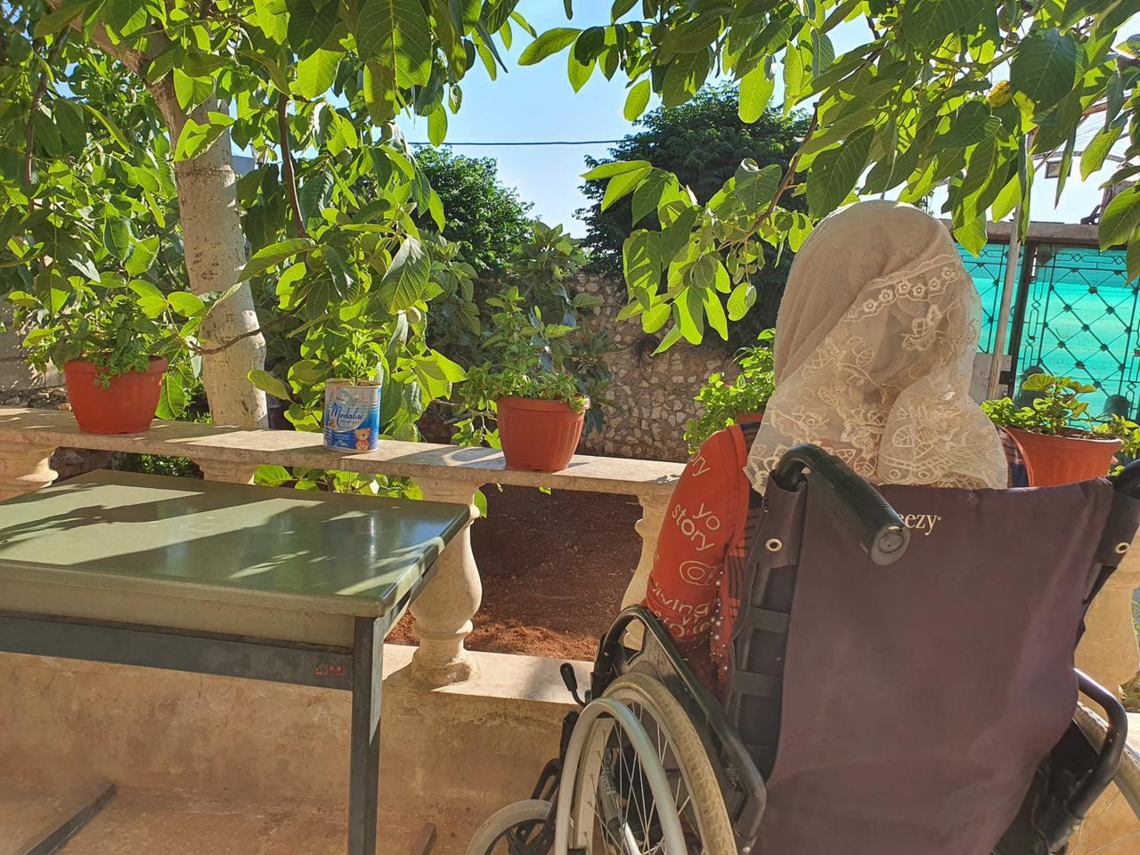 The little girl, Zarifa, suffers from hemiplegia and needs an electric chair