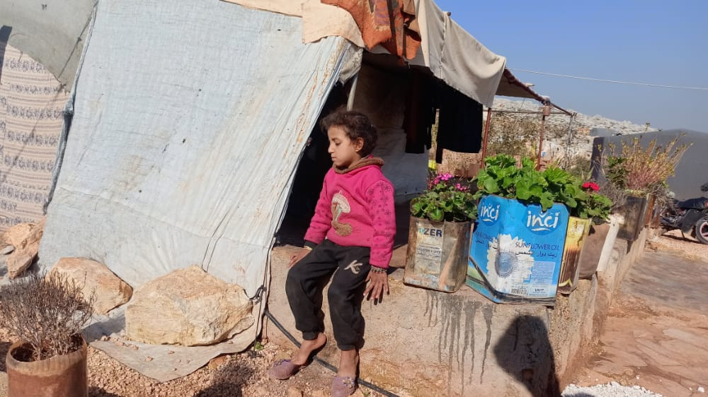 An orphan who lives with her aunt in a canvas tent.