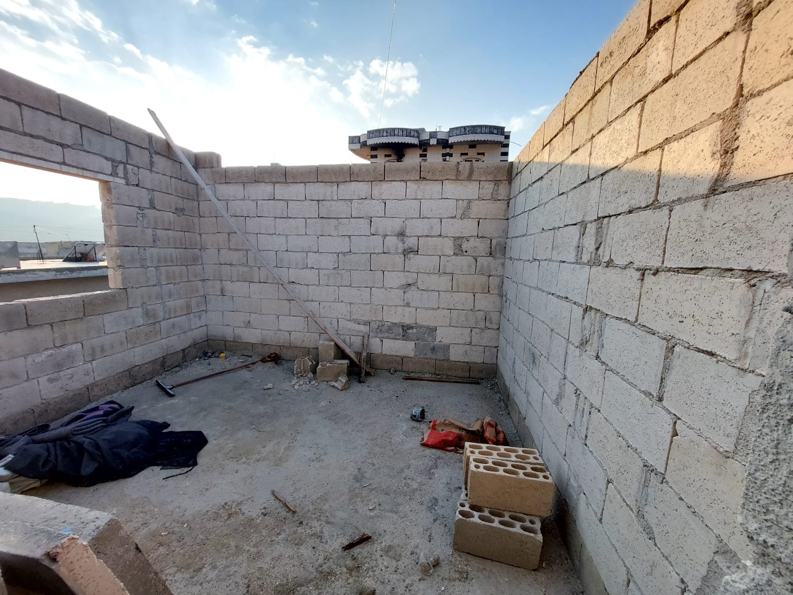 He tries to build a room for his widowed sister before winter