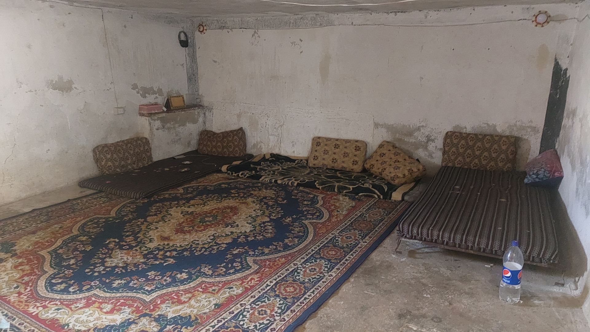 A family live in a basement under poor living conditions