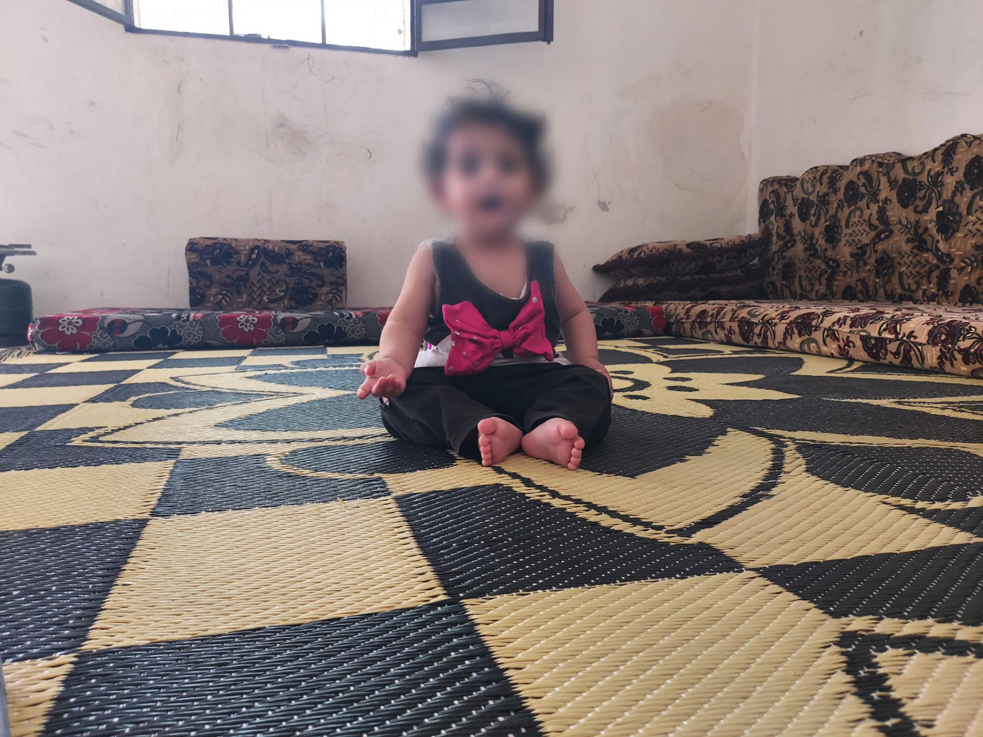 Little girl Ilham suffers from hearing loss and needs hearing aids