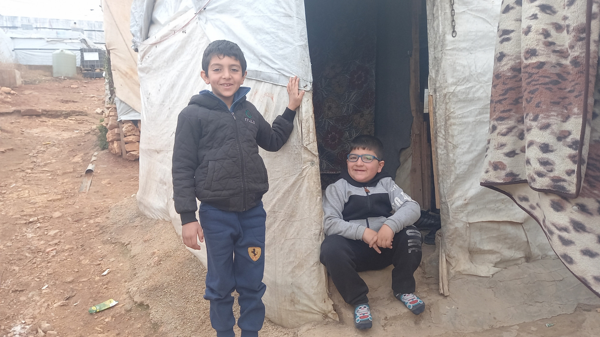 A family living in a tent in very harsh conditions