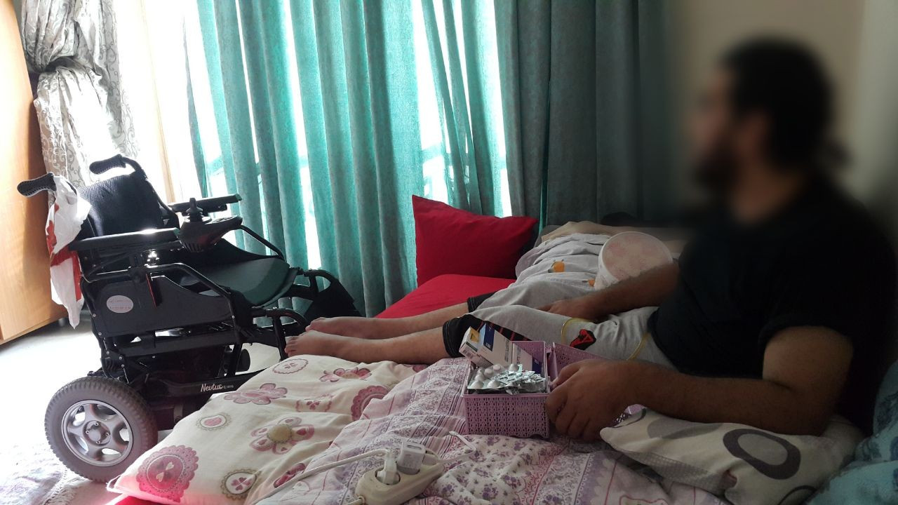 a sniper shot left Fadi paralyzed