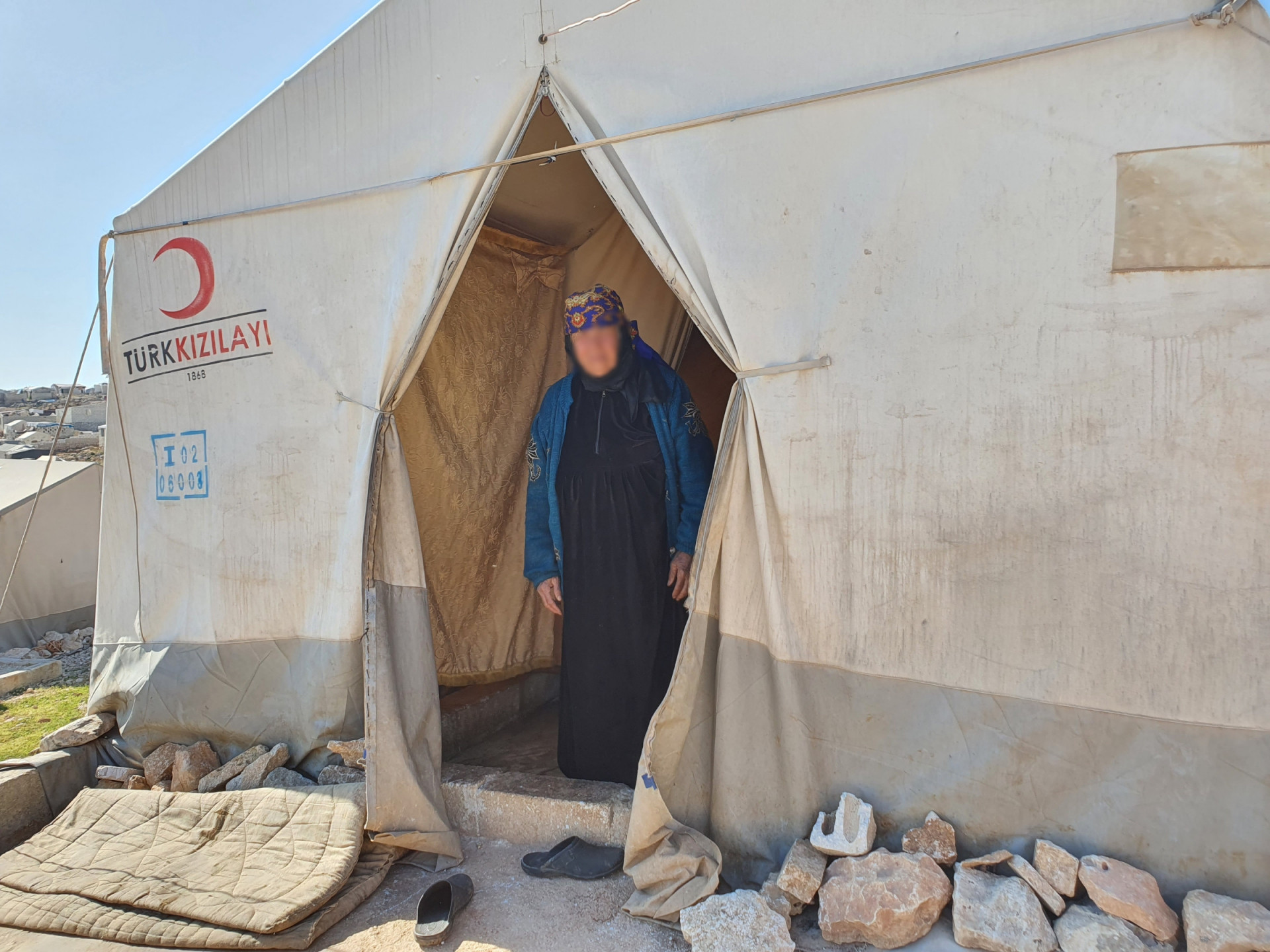 An elderly widow lost her husband and sons, and she is now alone suffering difficult living conditions in a tent!