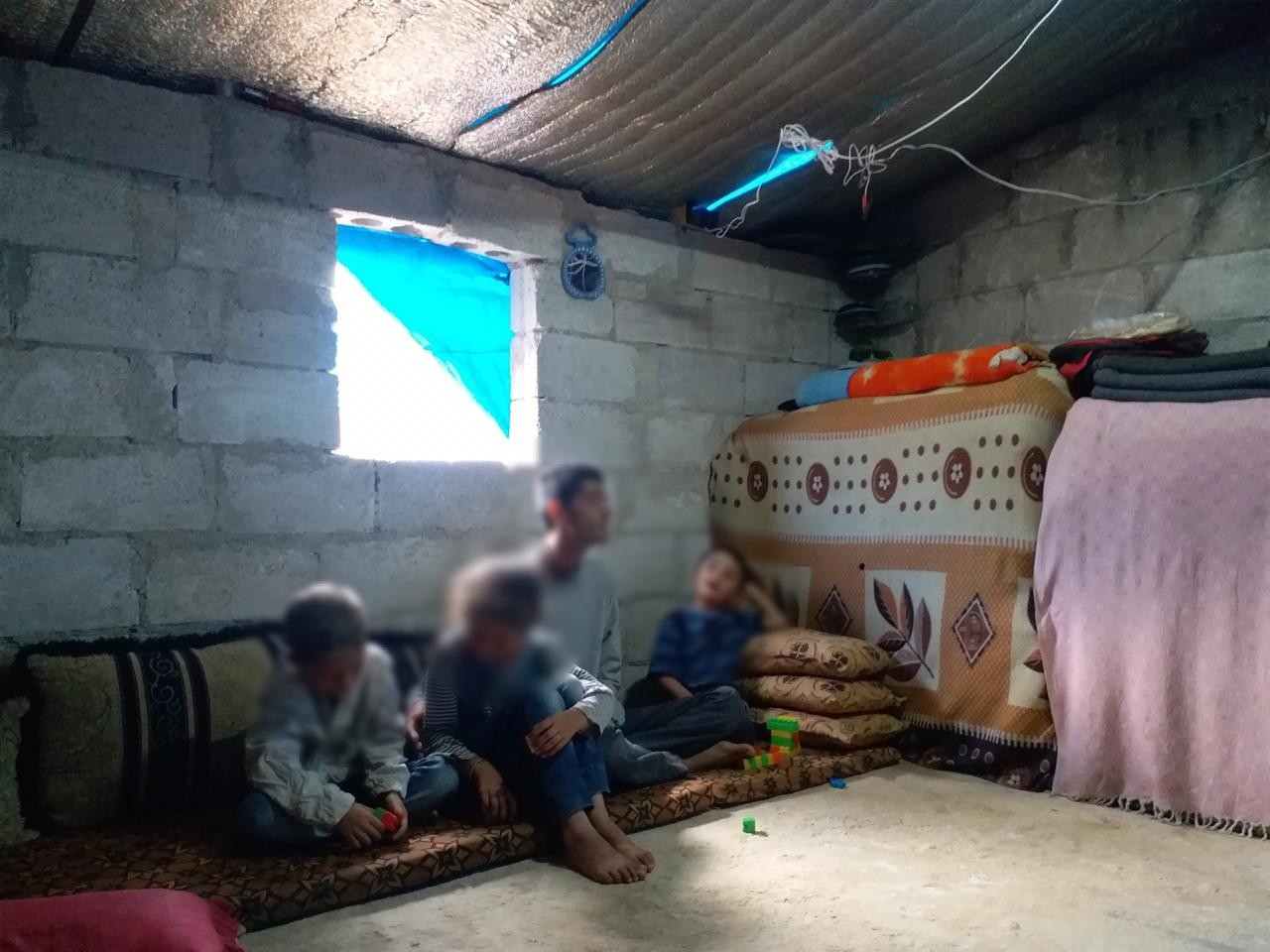 A paralyzed man with his children with no supporter