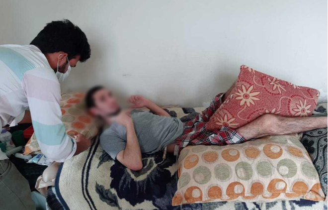 A man needs medical essentials to treat tetraplegia