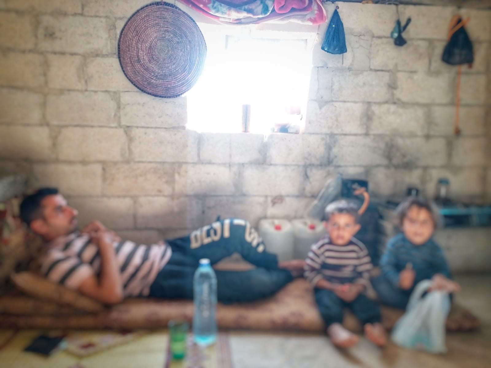 A displaced family lives in the camp in need of your help