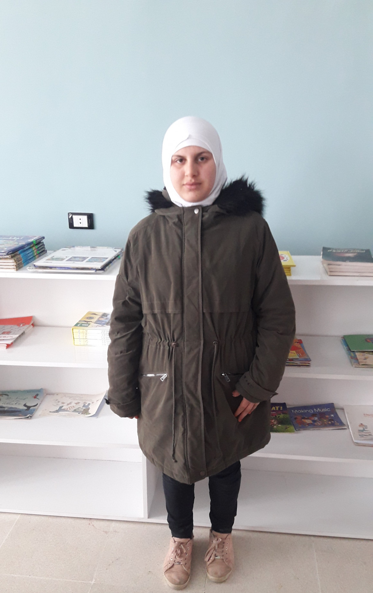 Aisha, an orphaned child in Gaza School
