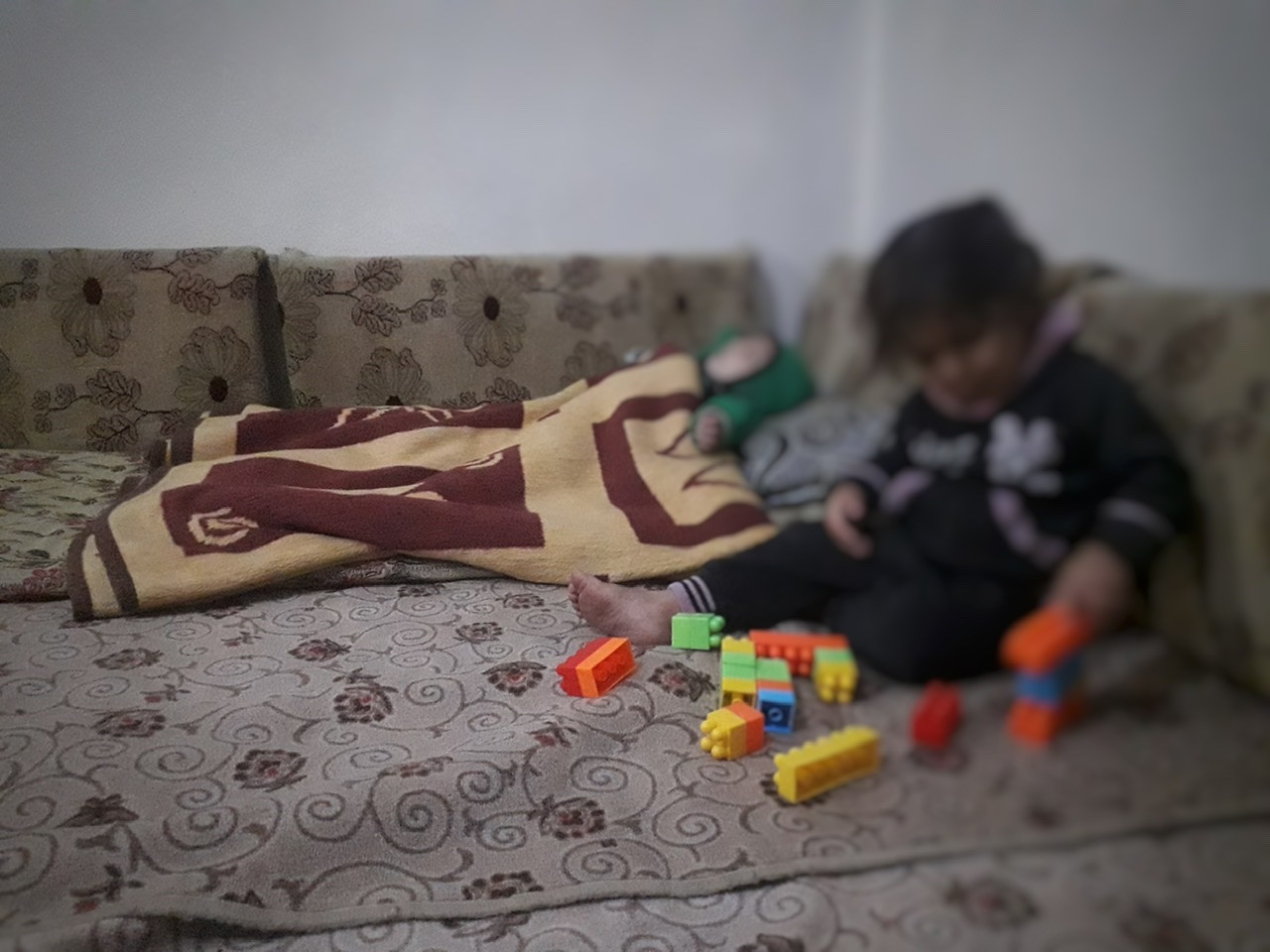 A displaced family needs heating materials and household basics.