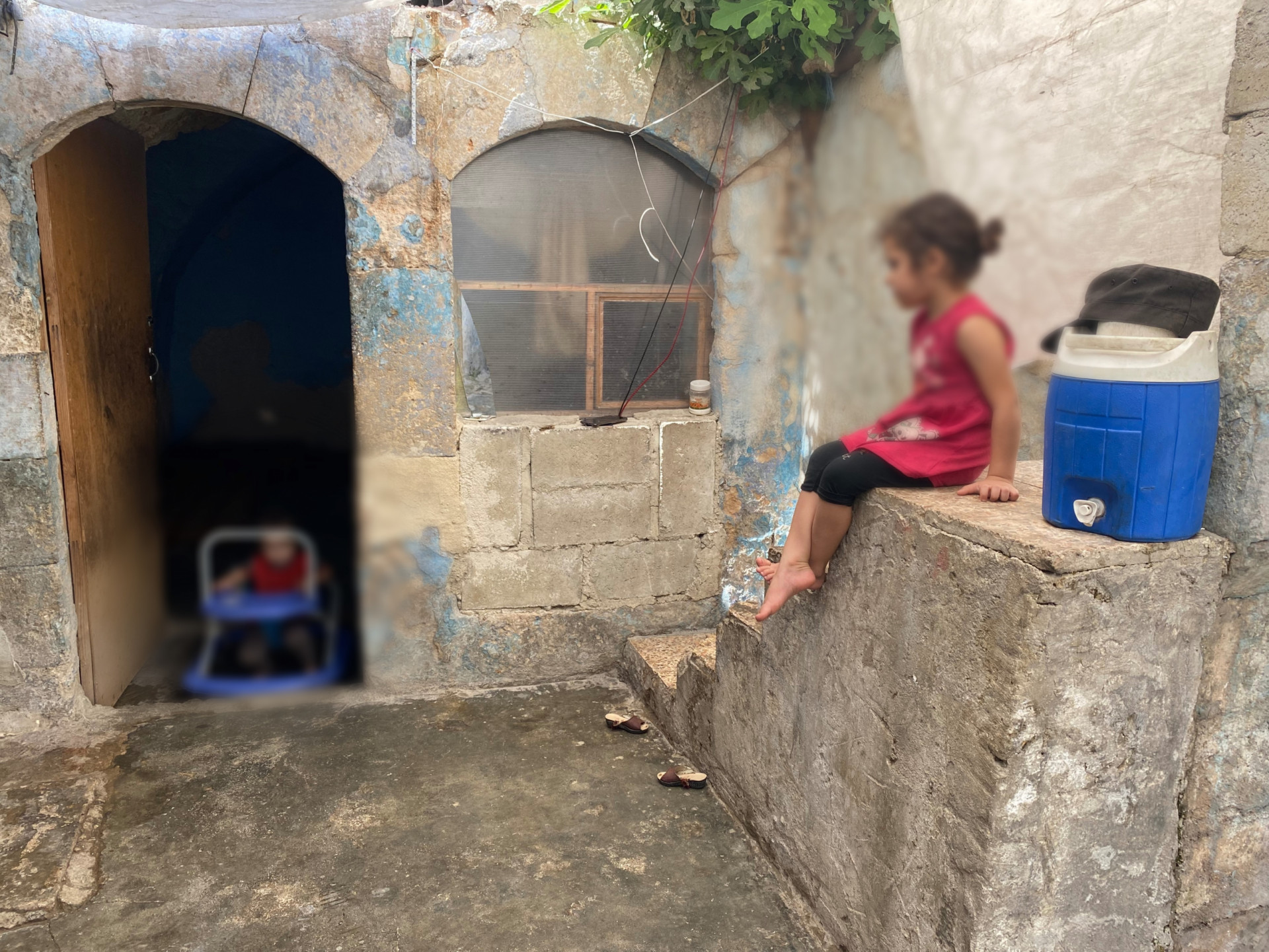 A sick little girl lives in a poor house with her family.
