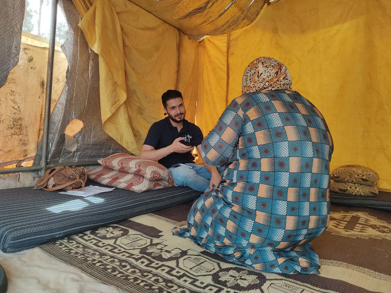 A displaced widow has been living in a tent with her neighbors for five years
