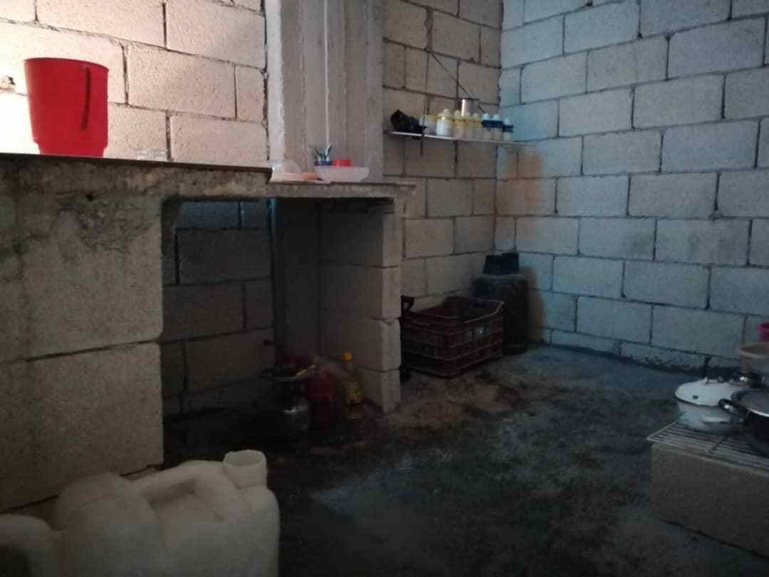 A displaced family lives in an unfinished house