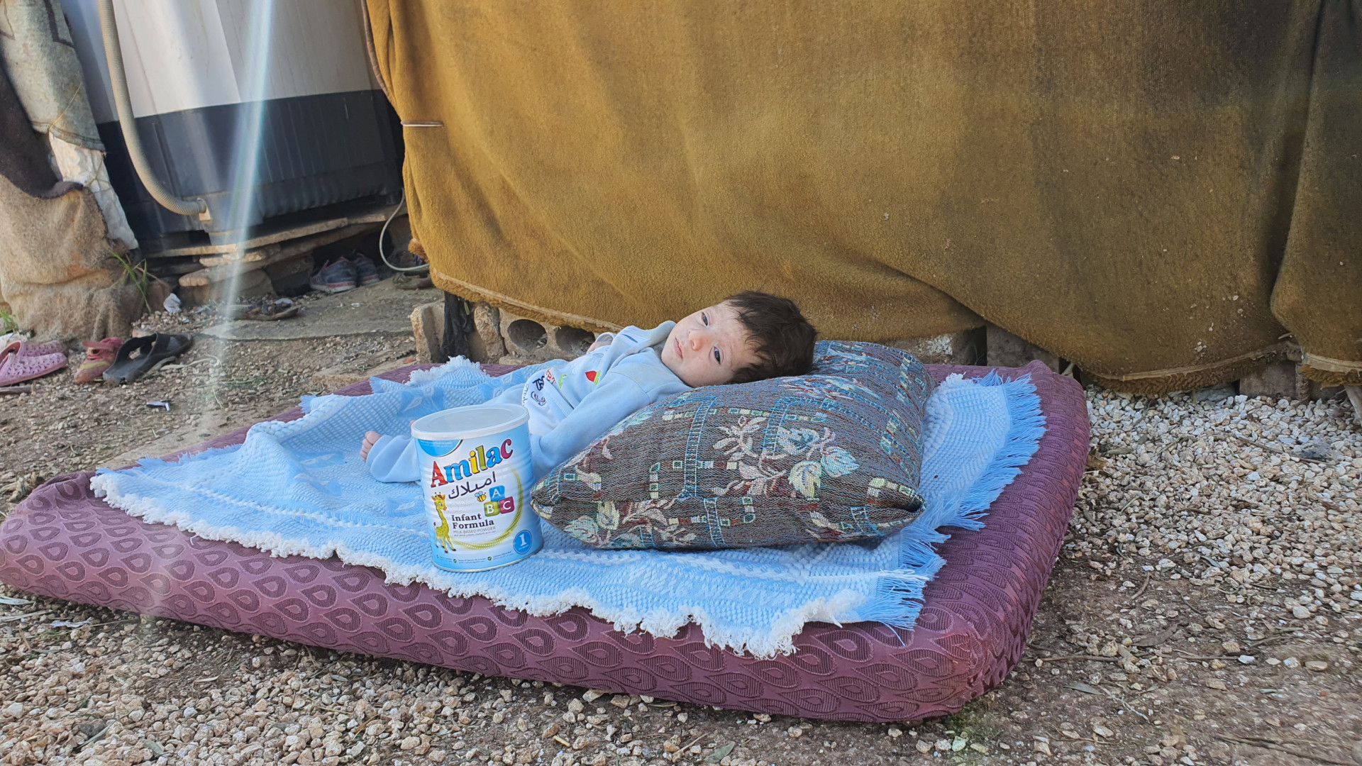 A child is in need of milk, can you please secure it for him?