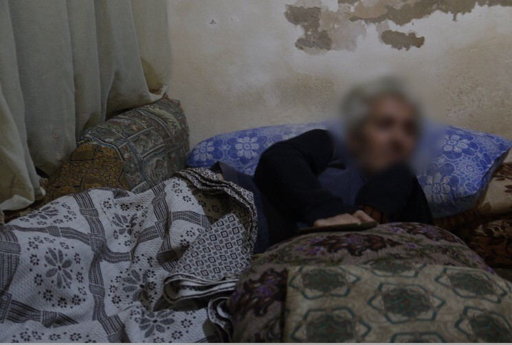 An elderly man needs a wheelchair and medications