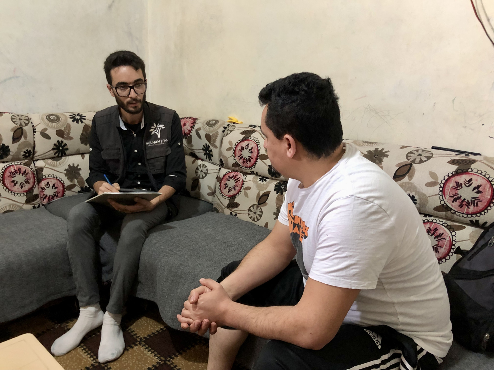 Imad sold his house furniture and sleeps on mats to live.