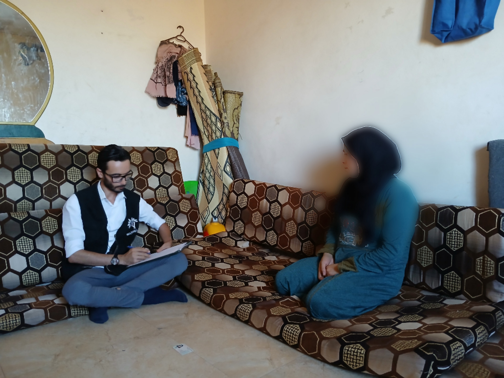 Two displaced families share life's worries and pains