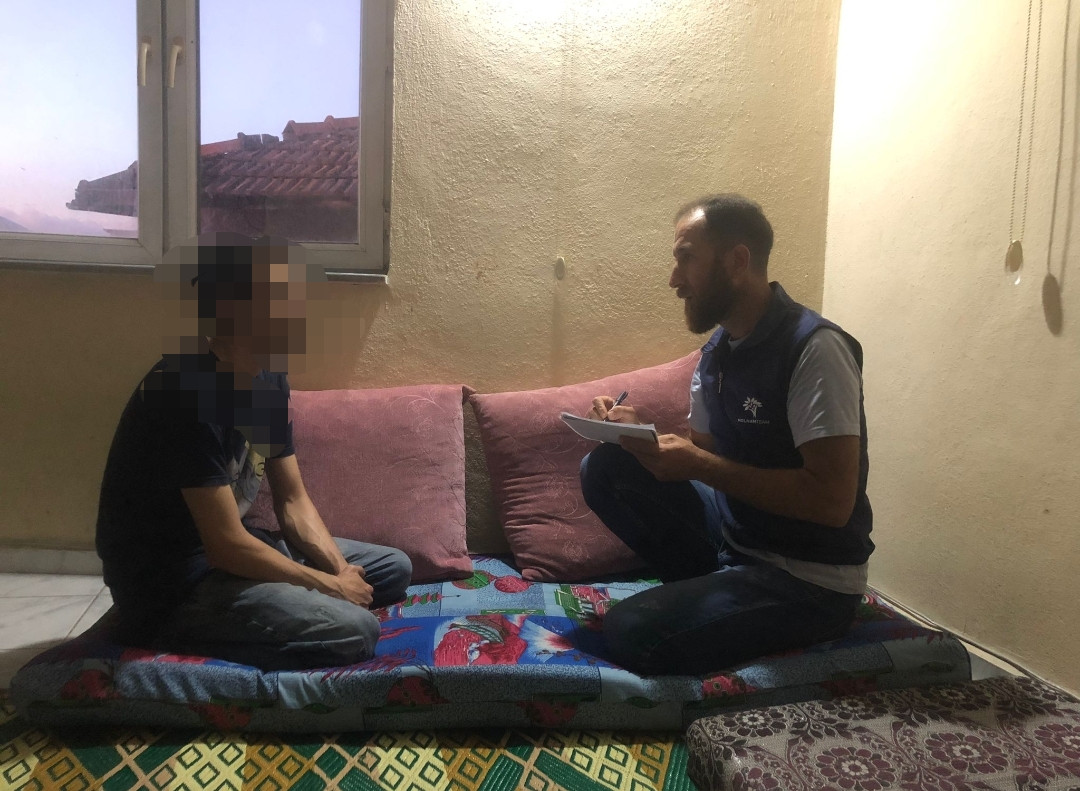 Ahmed navigates the shadows of exile, burdened by the relentless weight of financial hardship.