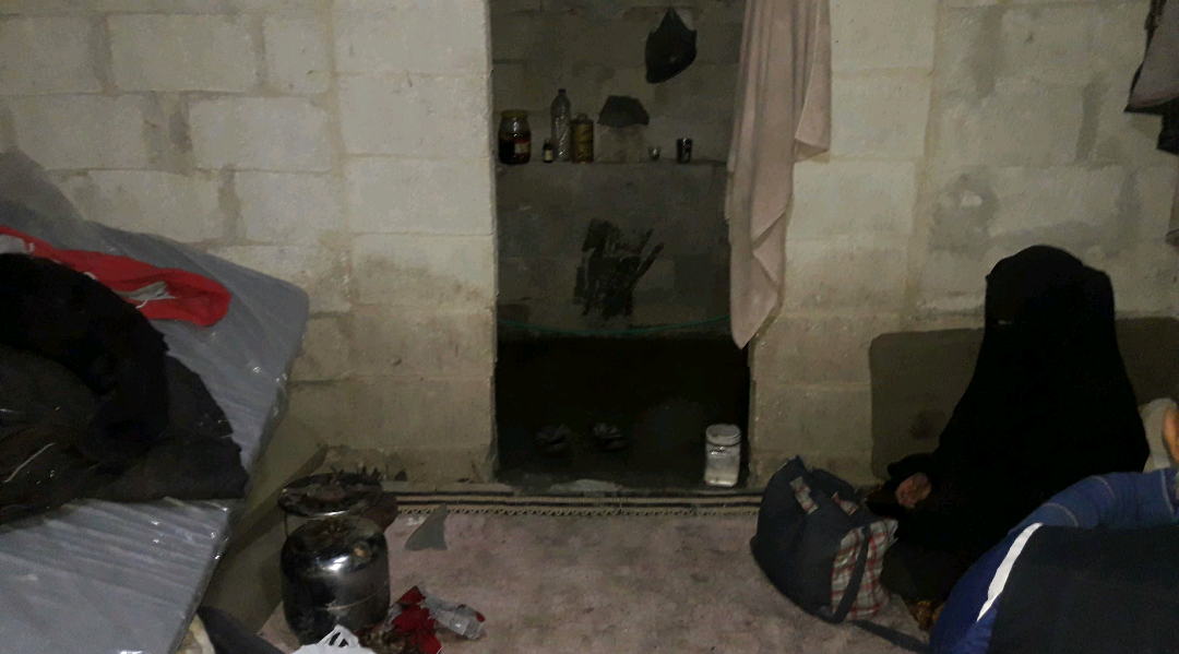 Woman soon to give birth inside a tent