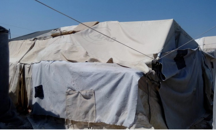 A widow living with her daughter in a tent without a breadwinner