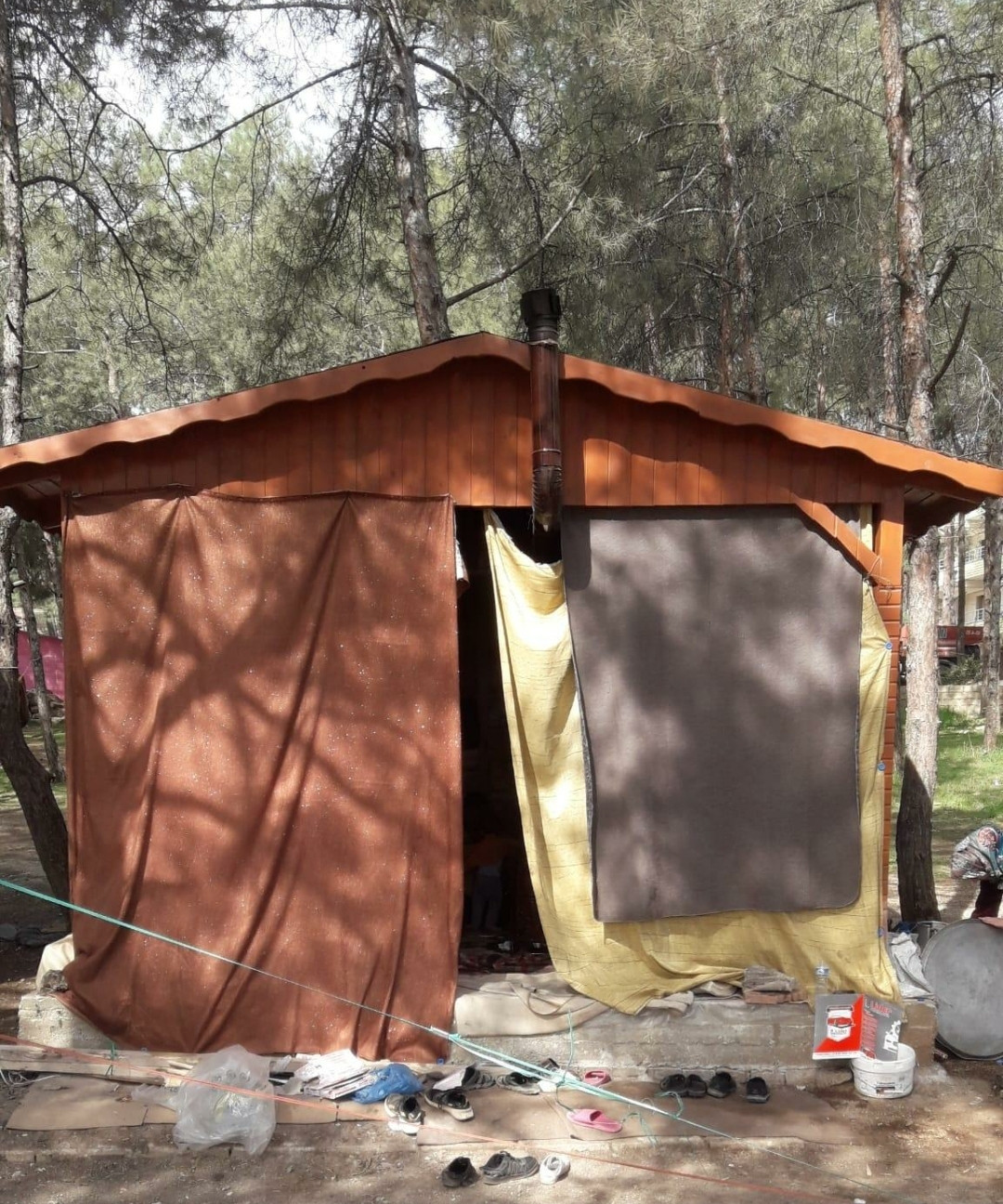 A family lives in the open air and needs a shelter to protect them from the cold of the winter.