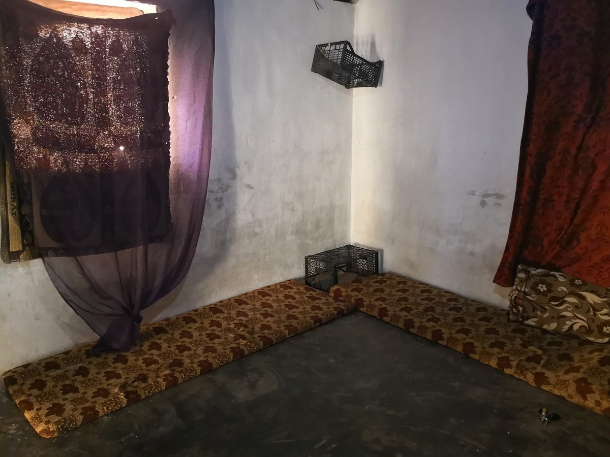 A displaced family in a camp in need of help