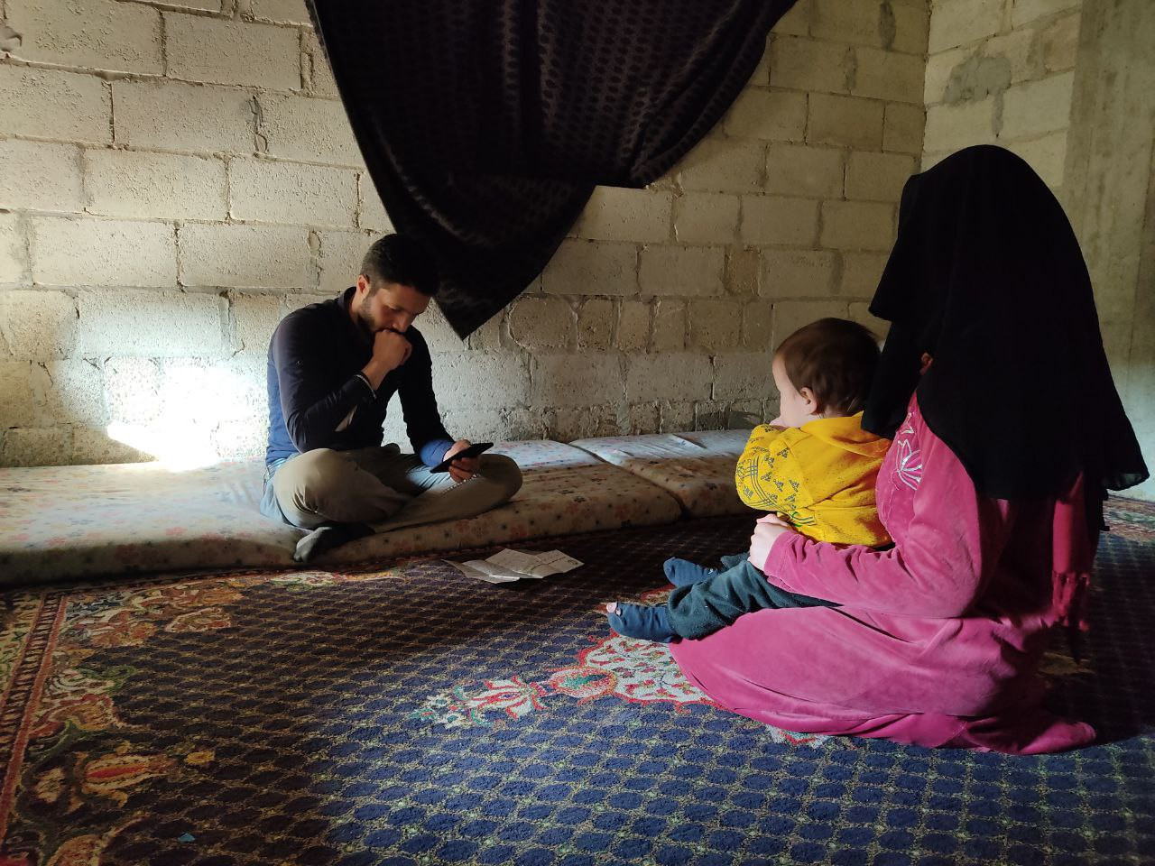 A family of six children lives in an unfinished house