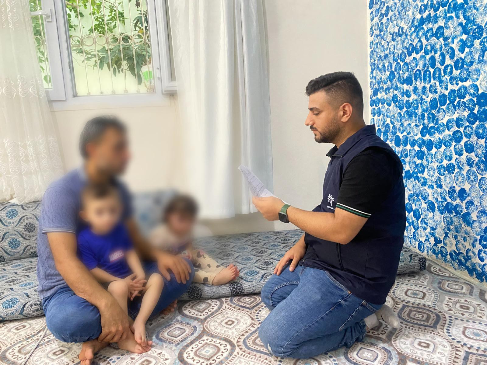 A family living in poor conditions with a sick child in need of treatment.