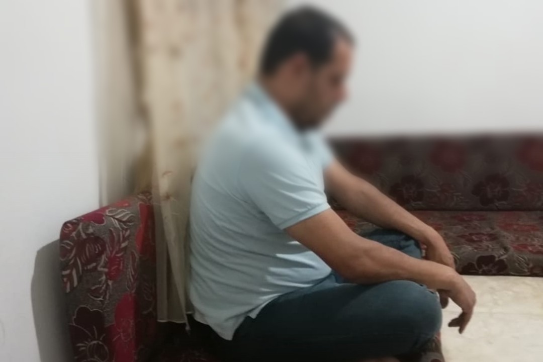 A man with back and feet pains