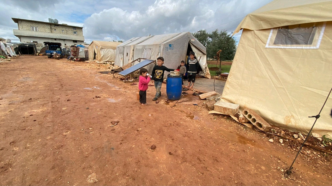 A family of nine are struggling in their worn-out tent