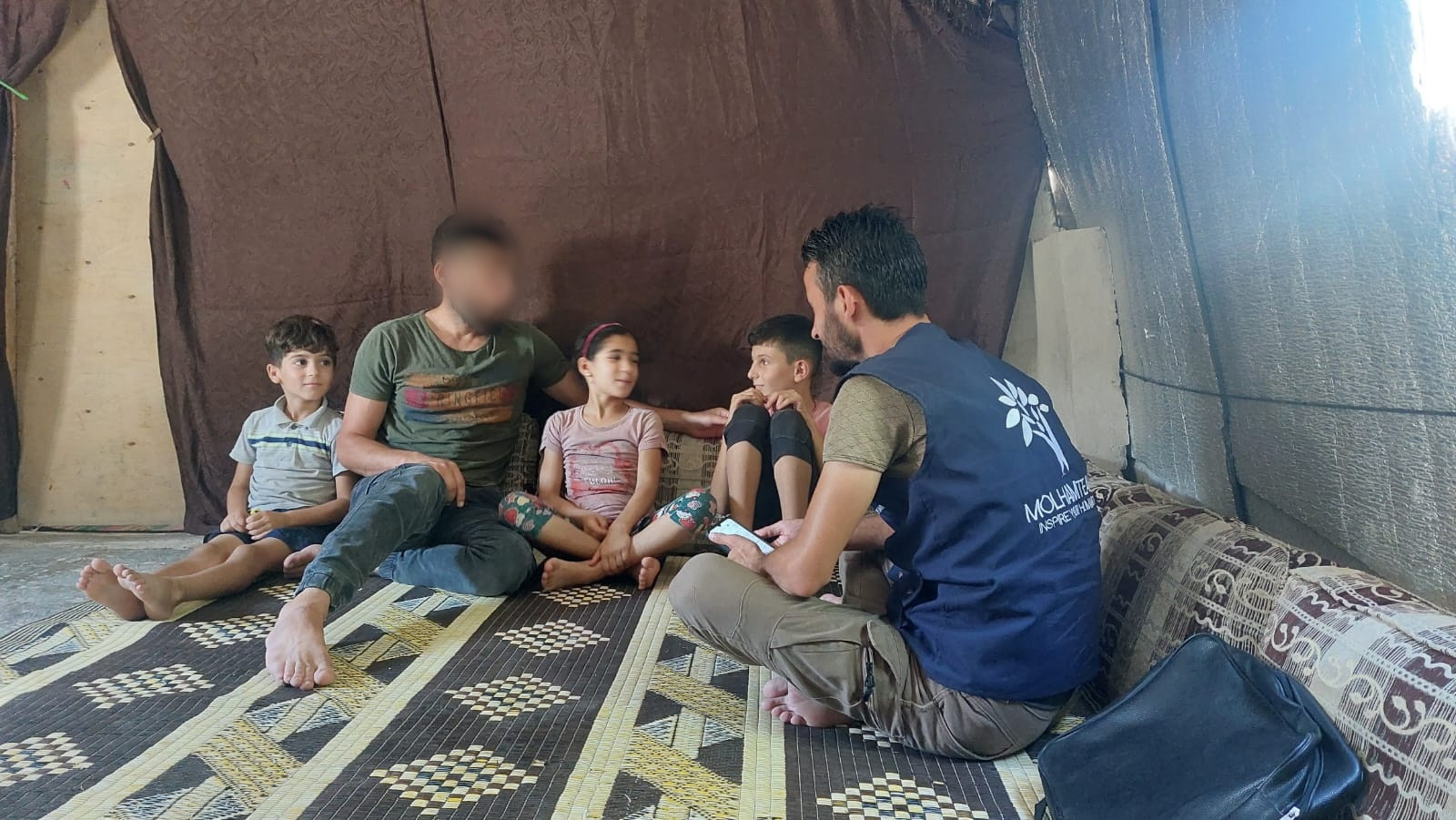 Let us, with your help, stand by Hussein and his children.