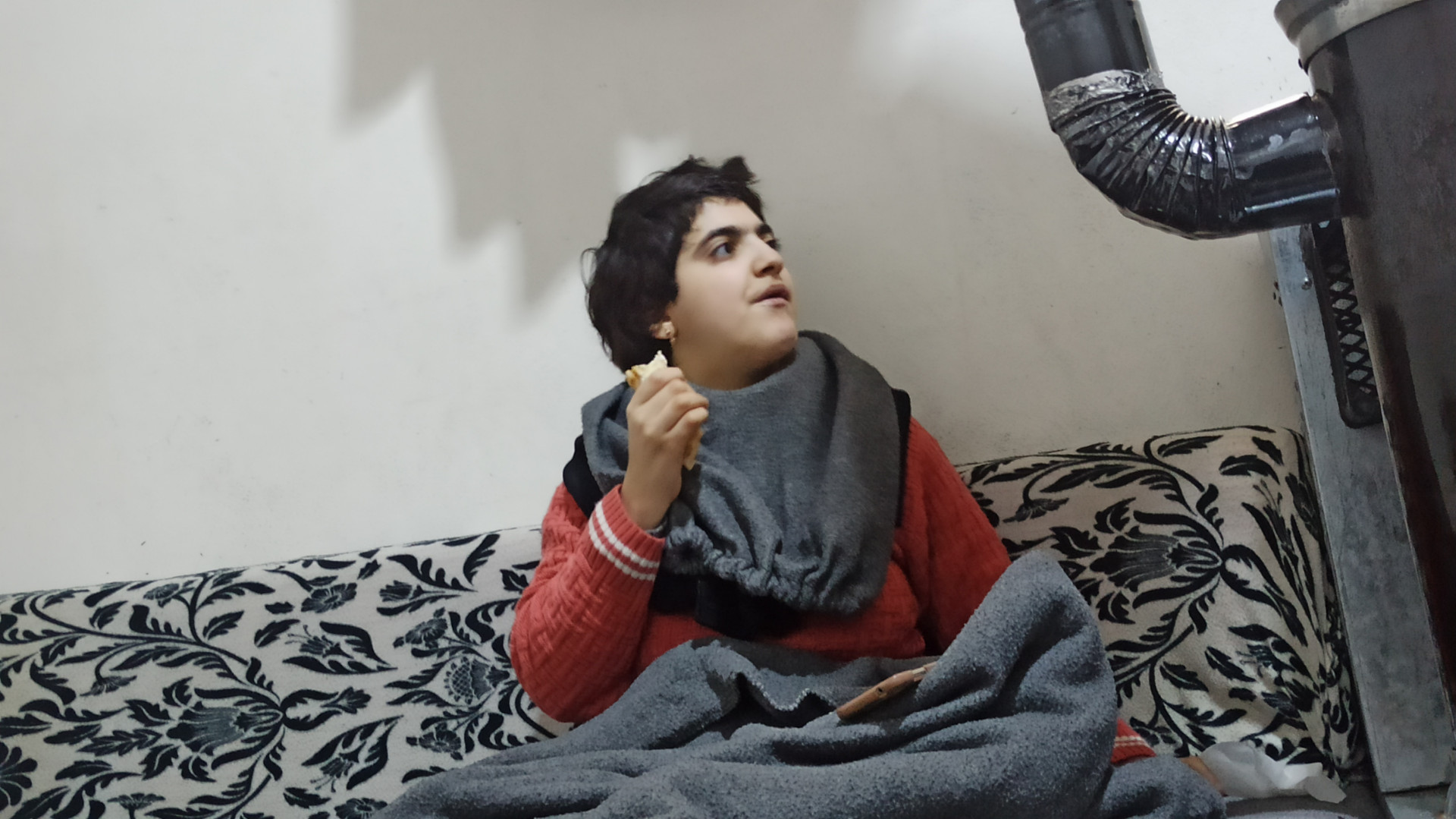 Two children suffering an illness while their father stands helpless.