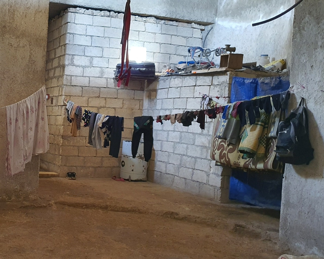 A family lives in an uninhabitable house without electricity
