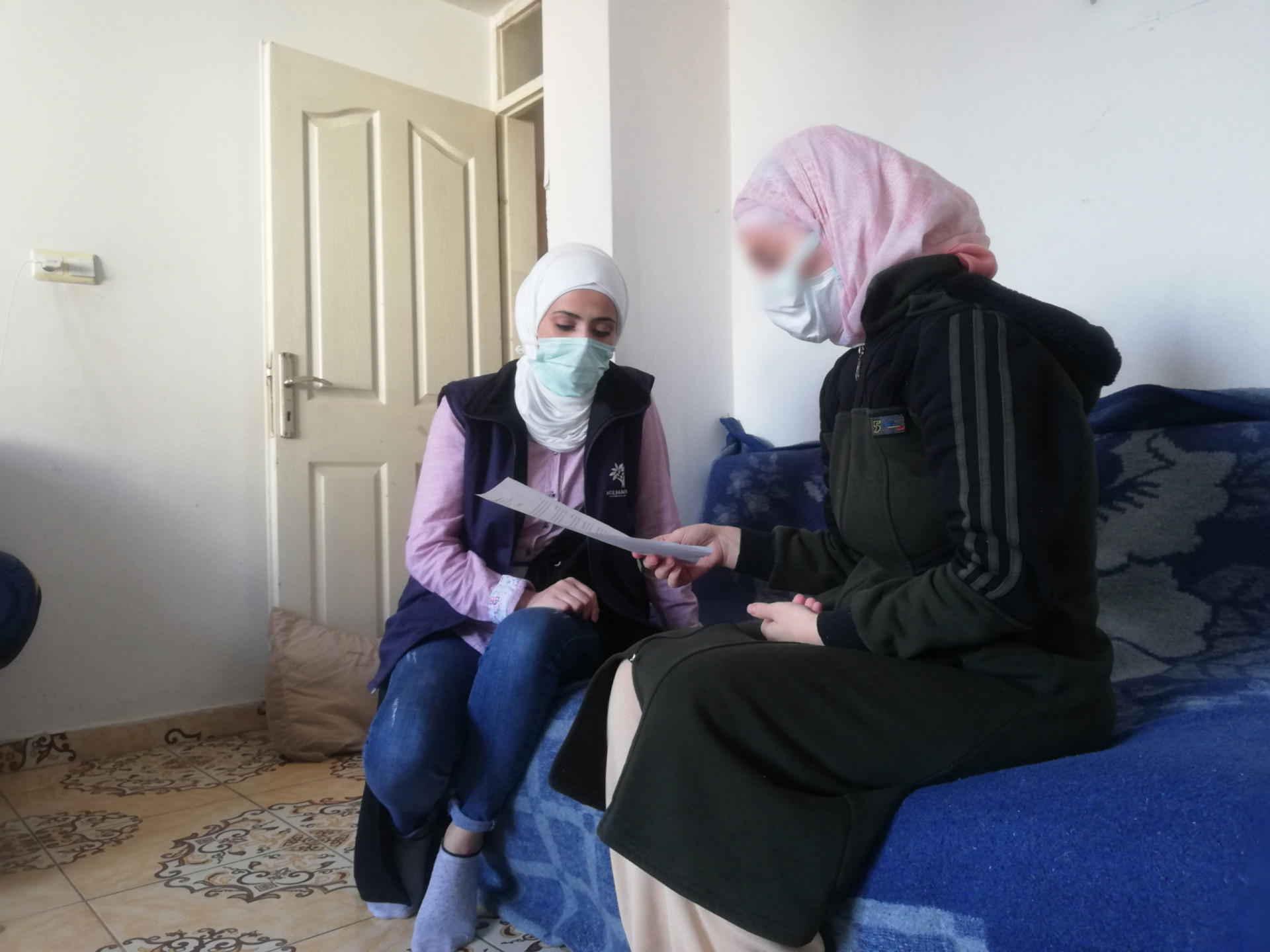 A mother of three children who have allergy and malnutrition