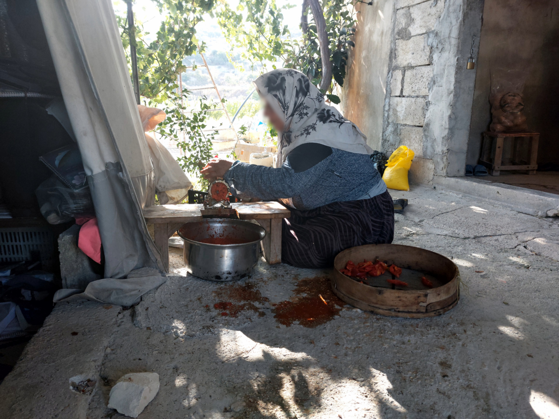 Umayya lives with her children in a tent in very difficult living conditions