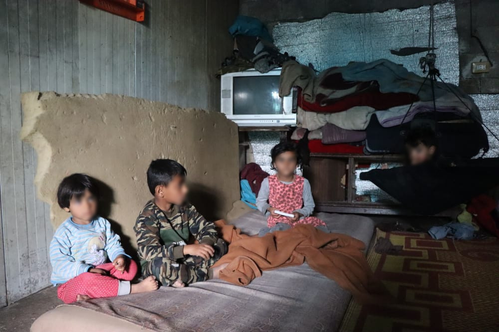 Adham and his family are living in an old tent with miserable conditions.