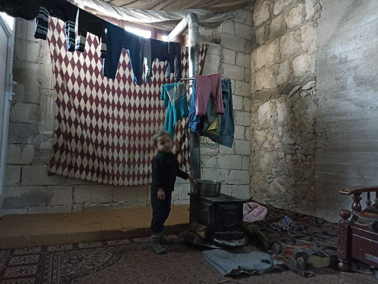A family struggles in miserable conditions
