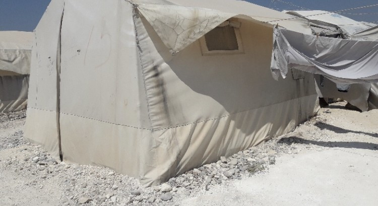 In a poor tent , a family waits your support