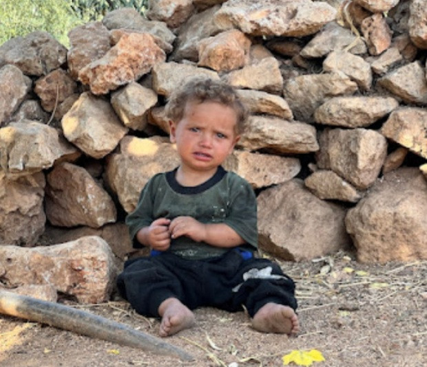 The pain is in his body and the helplesness is in his father's eyes.